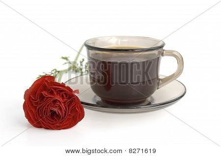 A Cup Of Coffee And Red Flower