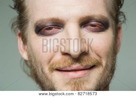 portrait of a man with hooded eyes.