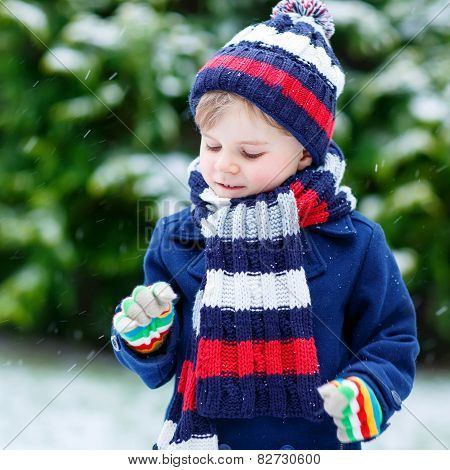 Little Boy Playing With Snow In Winter, Outdoors.