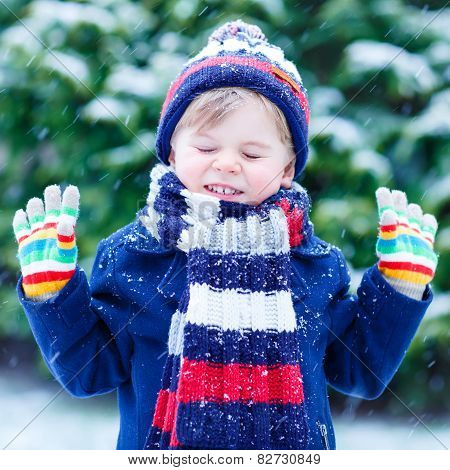 Little Boy Playing With Snow In Winter, Outdoors.