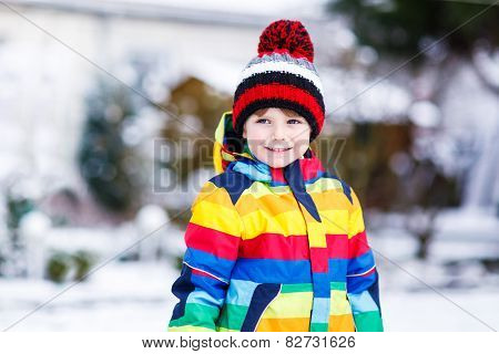 Portrait Of Little Boy In Colorful Clothes In Winter, Outdoors
