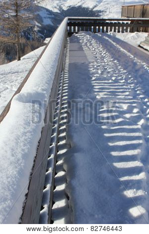 Fence covered with snow