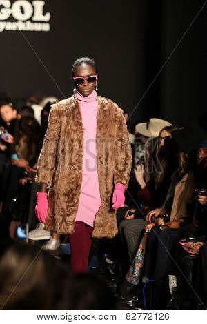 NEW YORK - FEBRUARY 13: A model walks the runway at the Mongol Fall/Winter 2015 collection during Mercedes-Benz Fashion Week in New York on February 13, 2015.