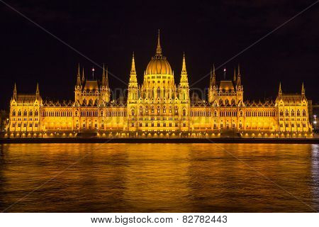 Budapest Parliament Building Illuminated During Evening, With Reflections In Danube River, Hungary,