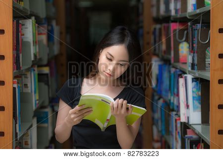 Asia Student At Campus In Library