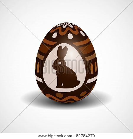 chocolate Easter egg with ornament and rabbit
