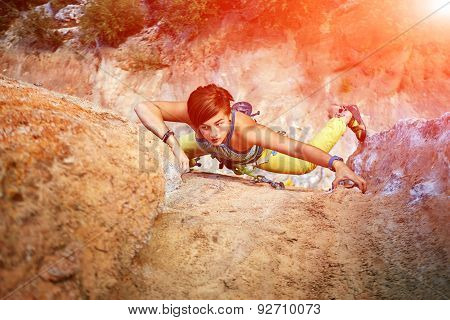 Rock climber climbing up a cliff