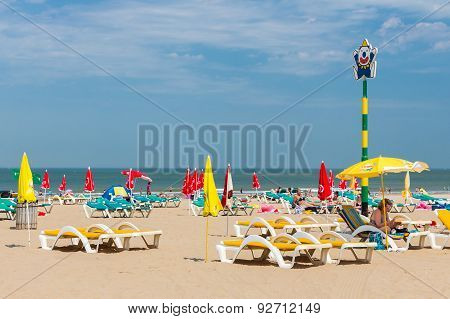 Seaside Visitors Relaxing In Beach Chairs At Dutch Beach Of Scheveningen