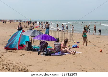 Seaside Visitors Relaxing  At Dutch Beach Of Scheveningen