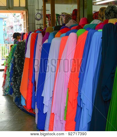 Many Colorful Reels Of Textile At Market