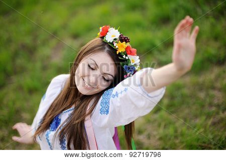 Ukrainian Girl In A Shirt And A Floral Wreath On Her Head Pulling Your Hands Up