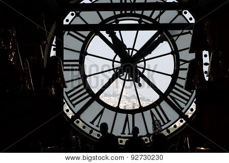 The Sacre Coeur seen through a window of museum D'Orsay in Paris