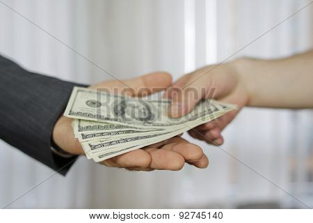 Corruption. Businessman in a suit takes a bribe