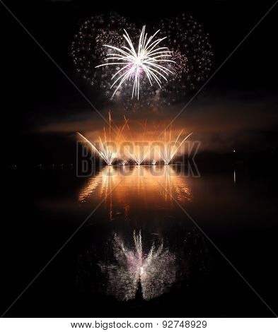 Colorful Fireworks With Reflection On Lake.