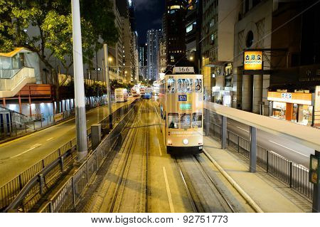HONG KONG - JUNE 03, 2015: double-decker tram on street of HK. Hong Kong Tramways is a tram system in Hong Kong, being one of the earliest forms of public transport in the metropolis