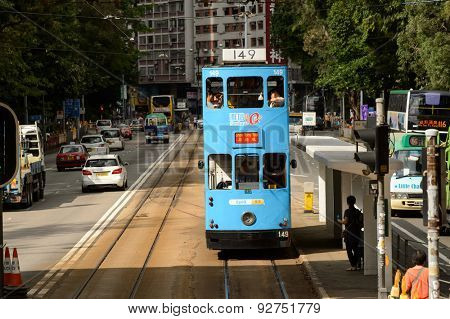 HONG KONG - JUNE 03, 2015: double-decker tram on street of HK. Hong Kong Tramways is a tram system in Hong Kong, being one of the earliest forms of public transport in the metropolis.