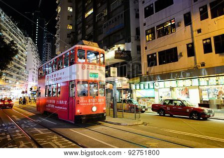 HONG KONG - JUNE 03, 2015: double-decker tram on street of HK. Hong Kong Tramways is a tram system in Hong Kong, being one of the earliest forms of public transport in the metropolis