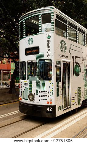 HONG KONG - JUNE 02, 2015: double-decker tram on street of HK. Hong Kong Tramways is a tram system in Hong Kong, being one of the earliest forms of public transport in the metropolis.