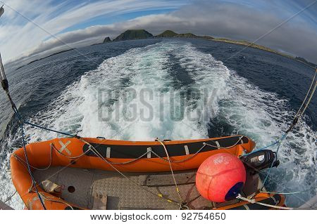 View to the beautiful sea landscape from the boat at sunset in Gjesvaer, Norway.