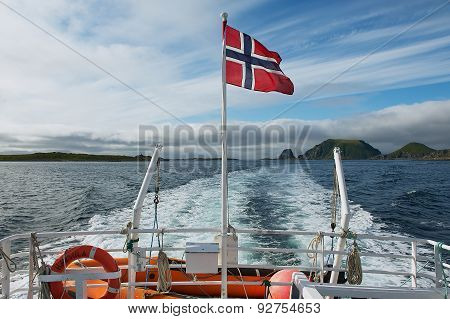 View to the beautiful sea landscape from the boat at sunset in Gjesvaer, Norway.