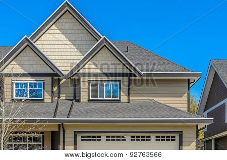 The roof of the house with nice window.