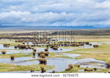 Illinois River meanders through Arapaho National Wildlife Refuge, North Park near Walden, Colorado, spring scenery with flooded meadows