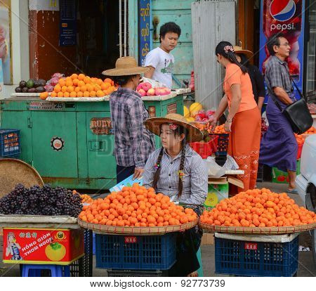 Burmese Women Selling Fresh Fruits At Bogyoke Market