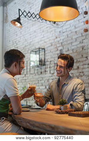 Two Men Cheers Toast Drink Ice Coffee, Asian Mix Race Friends