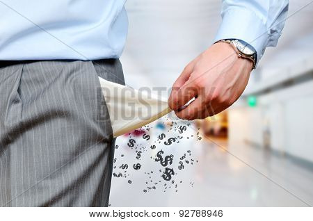 Man pulling out empty pockets