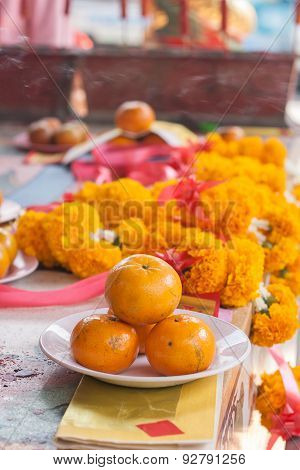 Orange On Dish In Chinese Shrine For Making Merit.