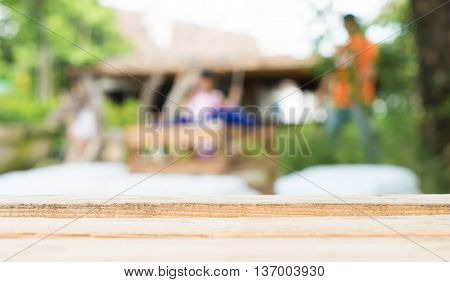 Wooden Table in family garden background cafe for backdrop.