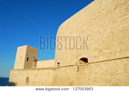 The mighty walls of the Castle Svevo Trani in Apulia - Italy