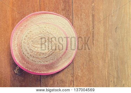 Farmer hat on table with vintage tone copy space.