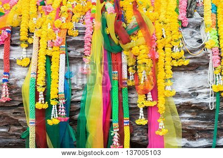 Colorful Buddhism garland on tree front view.