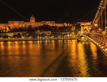 Buda Castle Chain Bridge Danube River Reflection Budapest Hungary. Buda Castle was first built in 1242 and enlarged by Empress Maria Theresa in the 1700s.