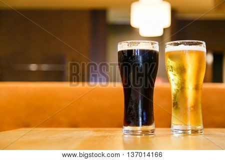 Cold alcoholic beverages by the glass pint on the table