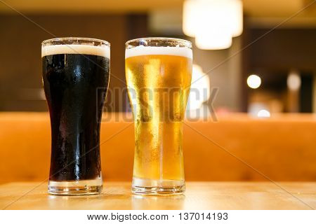 Cold alcoholic beverages by the glass pint on the wood table