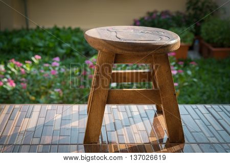 Small wooden chairs placed on the terrace.