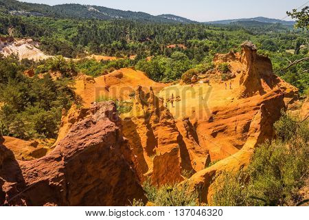 Picturesque orange and red hills. Quarry reserve - for ocher mining. Languedoc - Roussillon, Provence, France