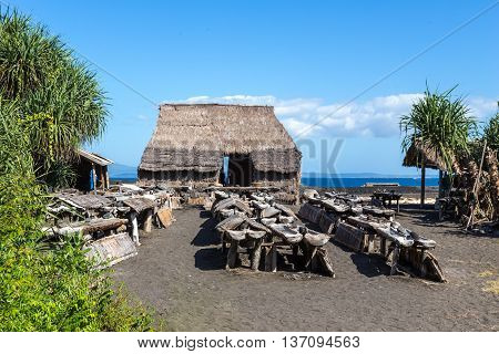 home factory for the production of sea salt on the ocean on a background of sky with clouds and water