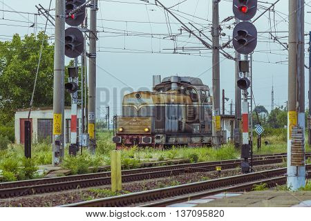 Caracal, Romania - June 19, 2016: Passenger train in station. Train of the National Railway Company (CFR). CFR  is the state railway carrier of Romania.