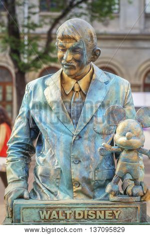 Bucharest, Romania - June 10, 2016: Walt Disney living statue at B-FIT in the Street. B-FIT is a cultural event that involves international artists and acrobats who act in theater plays on street.