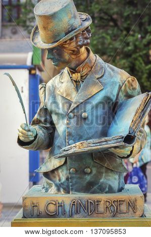 Bucharest,Romania - June 10,  2016: H. CH Andersen living statue at B-FIT in the Street. B-FIT is a cultural event that involves international artists and acrobats who act in theater plays on street.