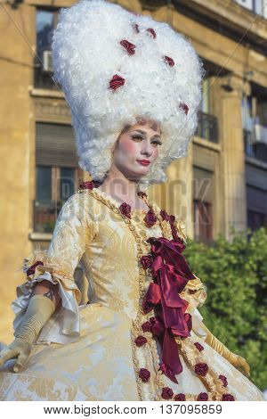 Bucharest Romania - June 10 2016: Ladies dressed in Baroque style at B-FIT in the Street. B-FIT is a cultural event that involves international artists and acrobats who act in theater plays on street.