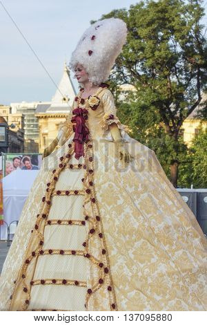 Bucharest, Romania - June 10, 2016: Ladies dressed in Baroque style at B-FIT in the Street. B-FIT is a cultural event that involves international artists and acrobats who act in theater plays on street.