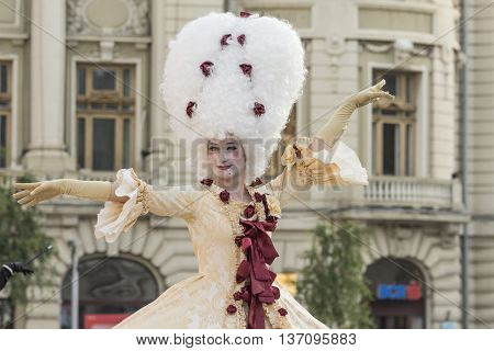 Bucharest, Romania - June 10, 2016: Ladies dressed in Baroque style at B-FIT in the Street. B-FIT is a cultural event that involves international artists and acrobats who act in theater plays on street.