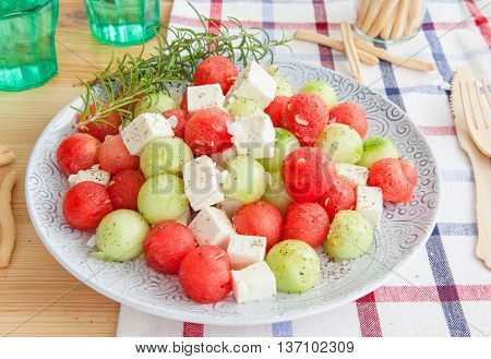 Cucumber salad with feta and water melon balls