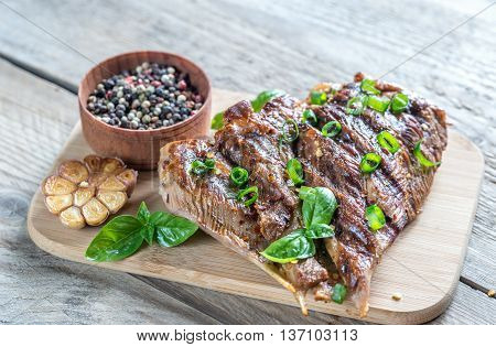 Grilled Turkey With Green Onion On The Wooden Board