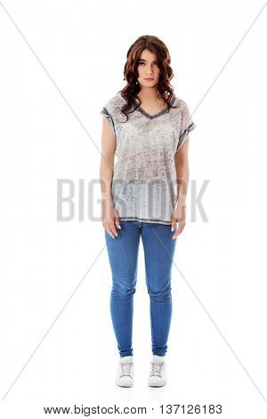 Young unhappy woman with long dark hair.