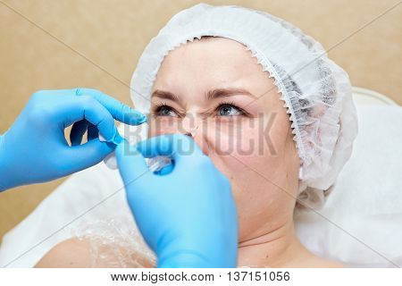 Anti-age injection therapy. Mimic wrinkles reduction in clinic